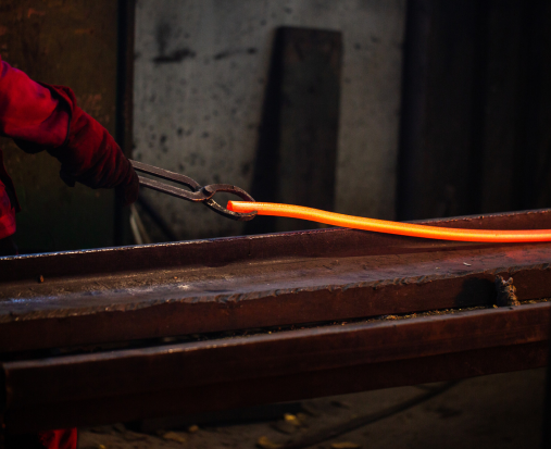 person working with melted steel