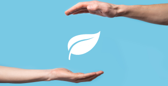 A man holding a green leaf with energy icons surrounding it, symbolizing sustainability and renewable energy sources.